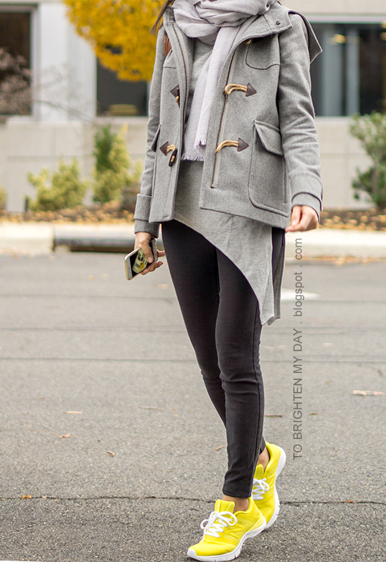 gray scarf, gray toggle duffle coat, gray asymmetric top, black skinny jeans, yellow sneakers