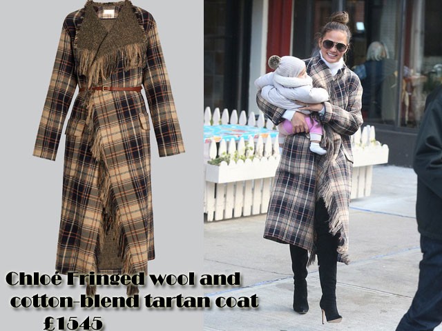 Chrissy-Teigen-in-Chloé-Fringed-wool-and-cotton-blend-tartan-coat, navy, beige, white and scarlet tartan jacket,  Chloé Fringed wool and cotton-blend tartan coat, tartan print coat, long coat, tartan long coat, winter coat, winter style, tonal-brown, navy, orange and beige mid-weight wool coat, white turtleneck, black thigh high jeans, gold hoop earrings, white turtleneck