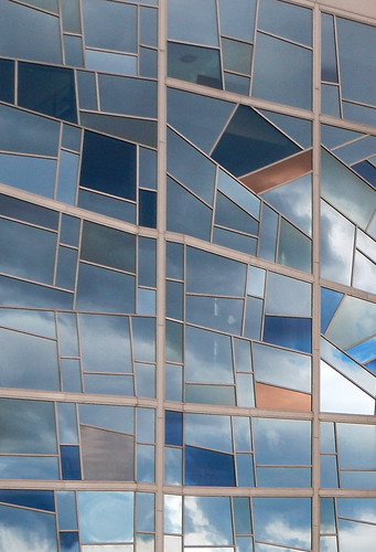 Stained glass windows reflecting the sky in Bilbao, Spain