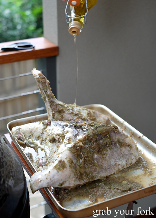 Drizzling olive oil over marinated kingfish head and collar at our Stomachs 11 Christmas dinner 2016