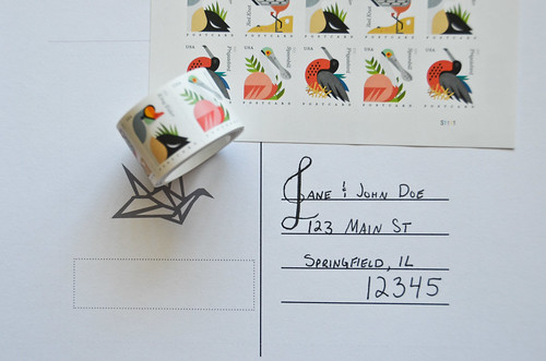 6 Apply theme-appropriate postcard stamps