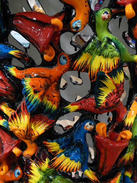 A bright ceramic birds decorate the outfit of a Katrina skeleton in Puerto Vallarta, Mexico