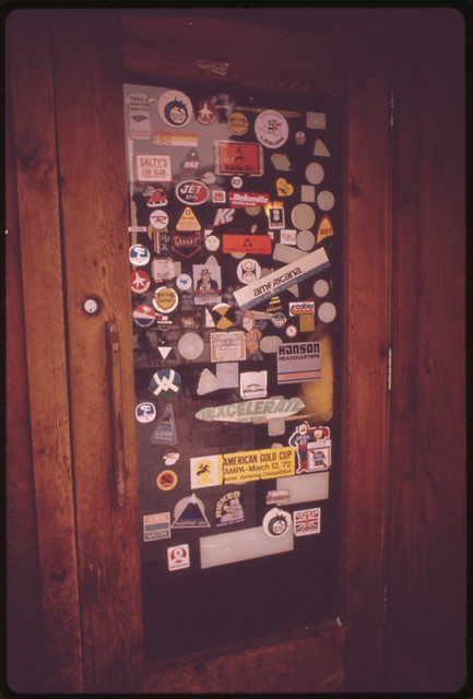 Ski Emblems Decorate Door of Donovans, an Apres Ski Spot 02/1974