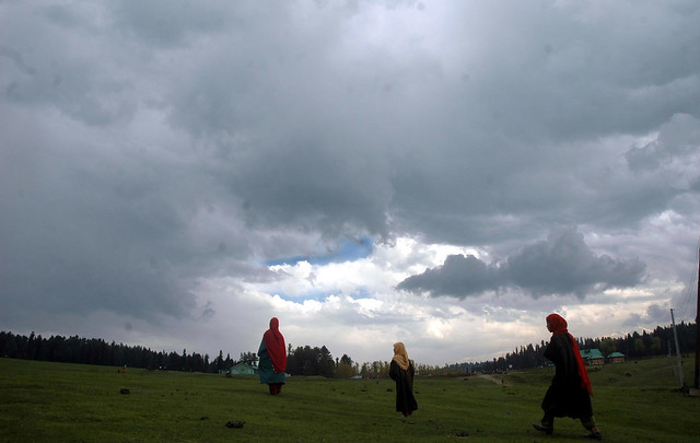 Kashmiri Girls under a cloudy sky