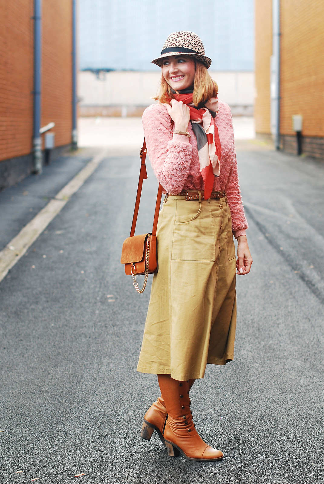 Autumnal layering with multi textures and soft colours: Camel midi skirt, pink textured sweater, tan knee boots, leopard print hat | Not Dressed As Lamb, over 40 style