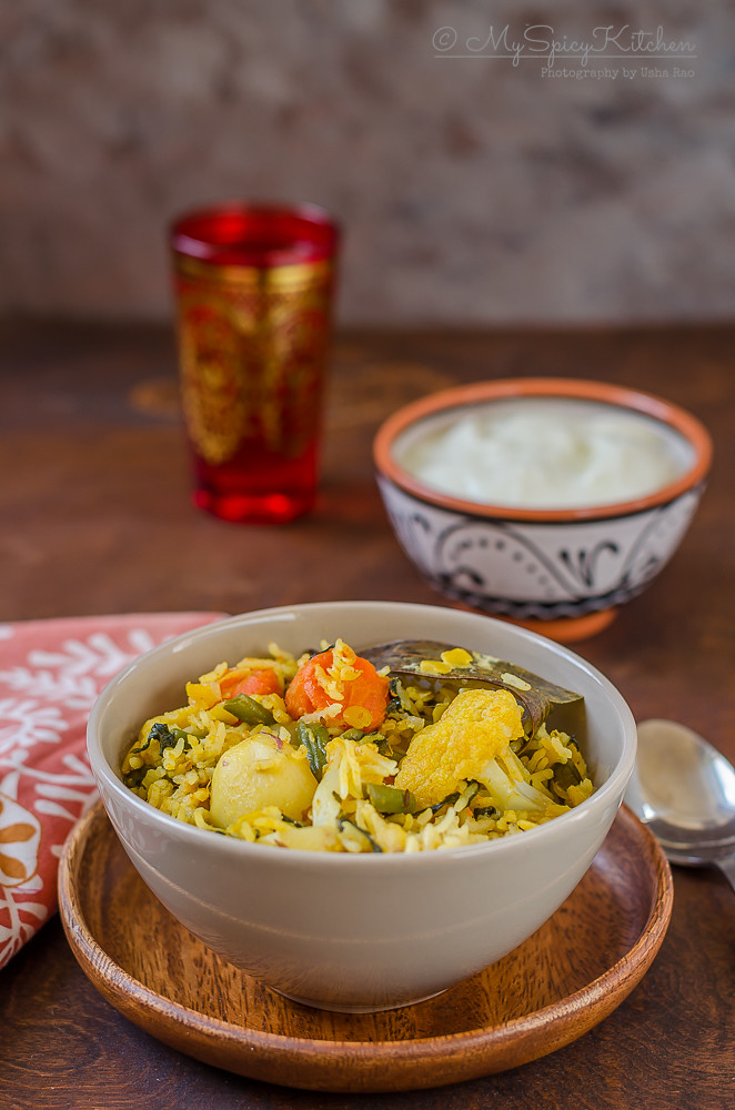 Bowl of Toor Dal Vegetable Khichdi on a wooden plate, 