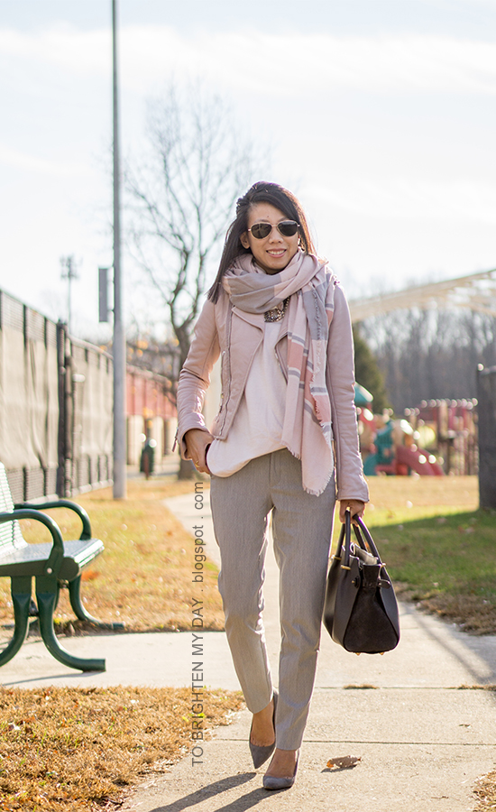 pink striped blanket scarf, lilac pink leather jacket, pale pink sweater, light gray pants, gray tote, gray suede pumps