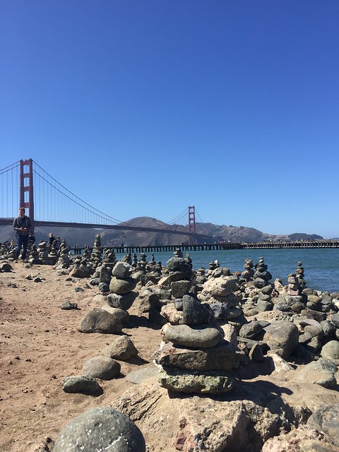 The golden gate bridge and the peculiar towers of balancing rocks in front of it