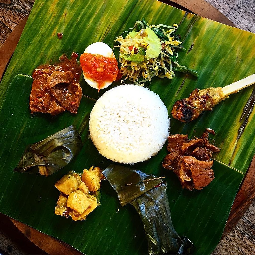 Nasi campur Bali - a pretty mix of balinese dishes served on banana leaf