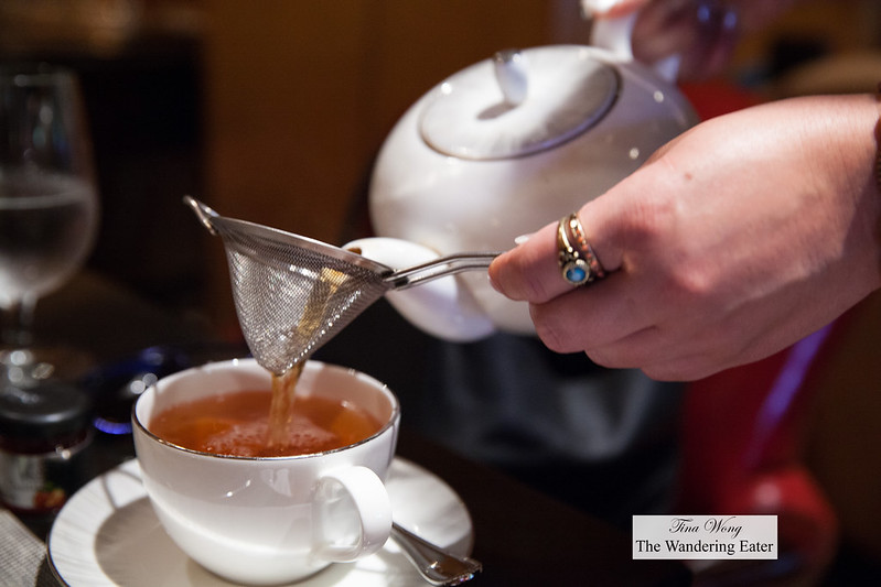 Pouring my Orange Jasmine tea (orange slices, jasmine blossoms and other fruits with Ceylon and Chinese black tea)