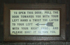 pull the door towards you with your left hand & twist the latch to your left with your right hand