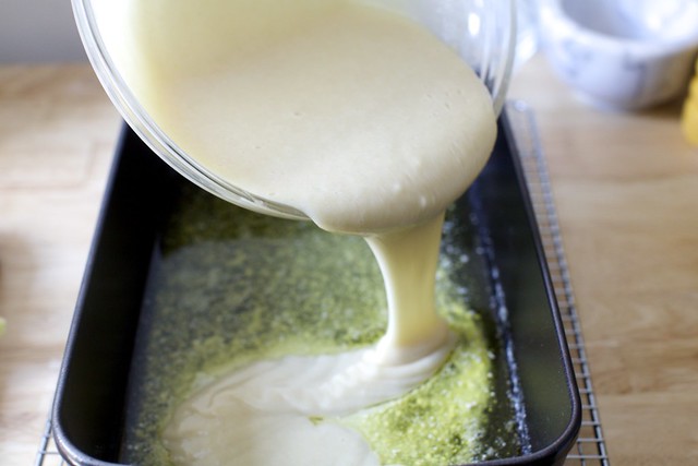 pour the batter over melted butter