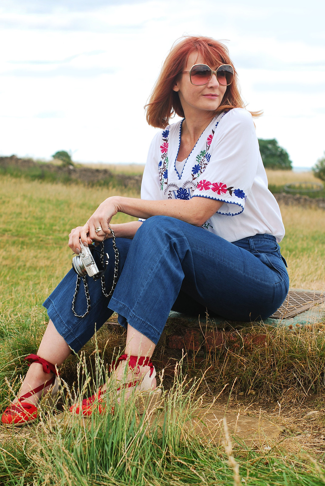 Embroidery and denim: Greek-style embroidered top, wide leg jeans, red lace-up espadrilles | Broadway Tower, The Cotswolds | Not Dressed As Lamb
